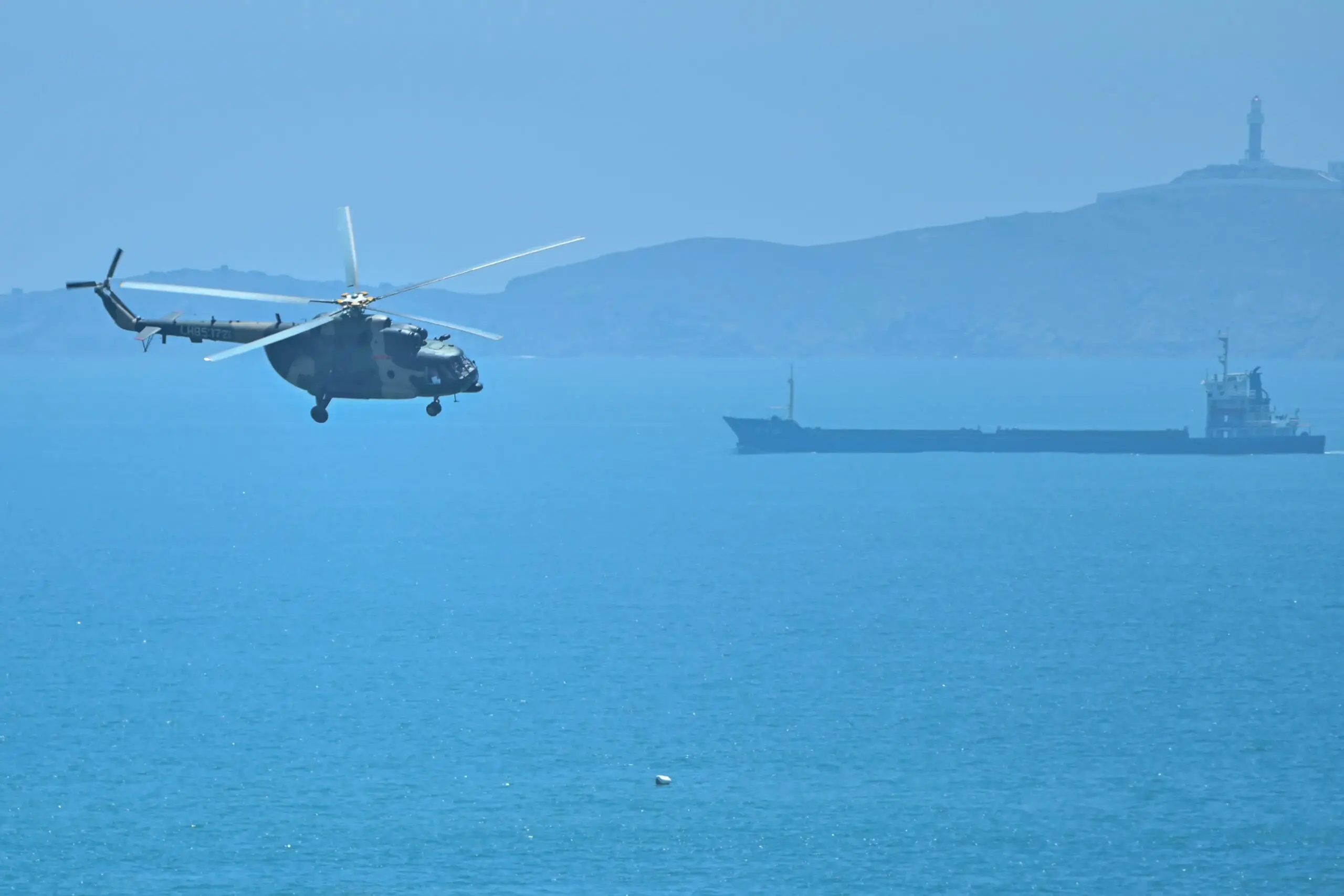 A Chinese military helicopter flies past Pingtan island, one of mainland China’s closest points to Taiwan