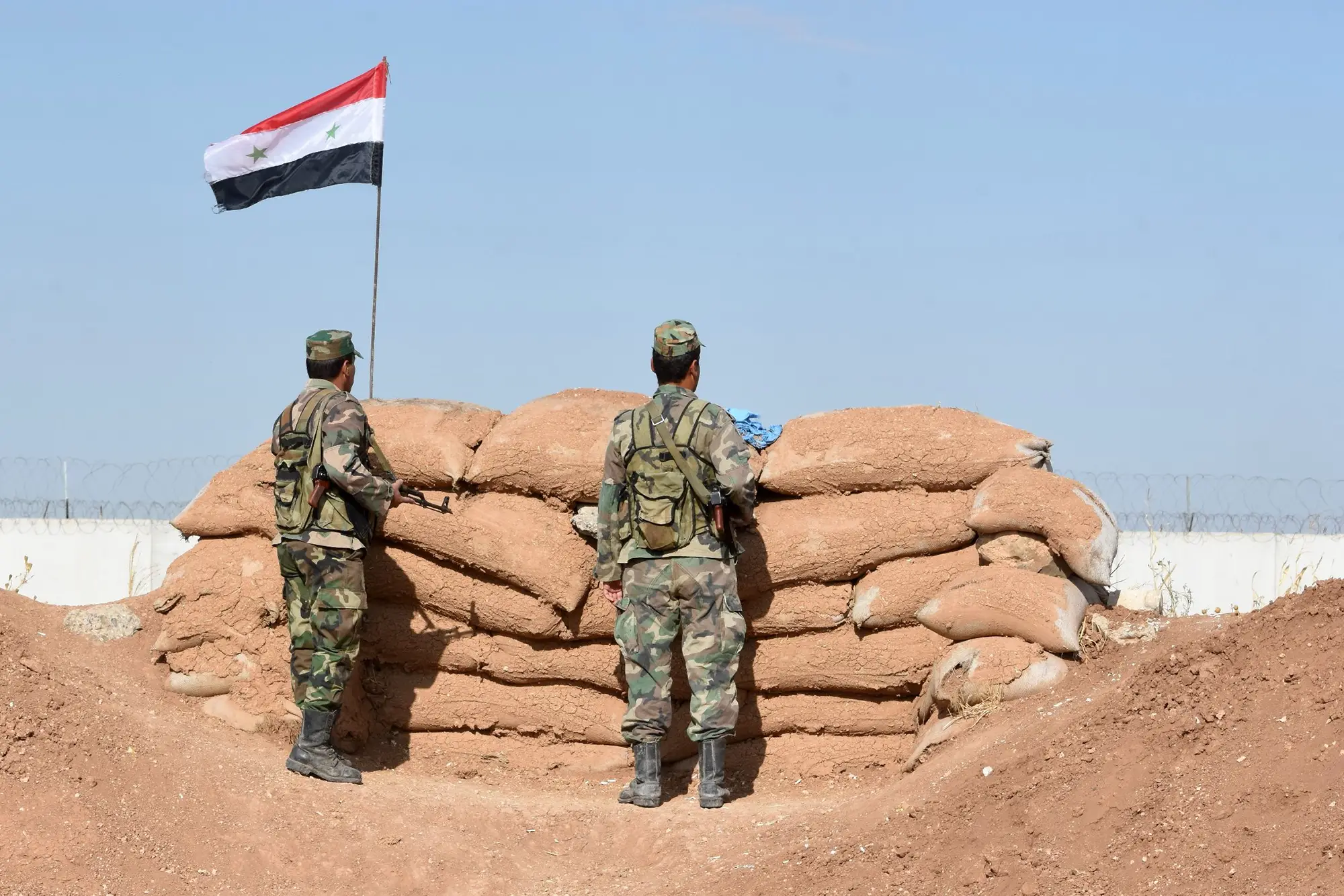 Syrian regime forces manning a position in the countryside city of Kobane, also known as Ain al-Arab, along the border with Turkey
