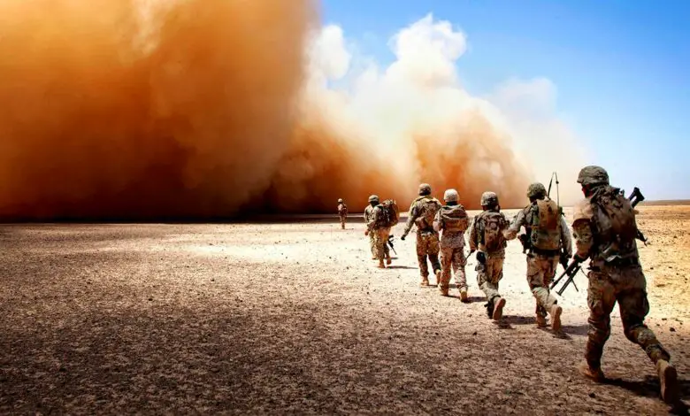 US Marines and Georgian Army soldiers run to the extraction point