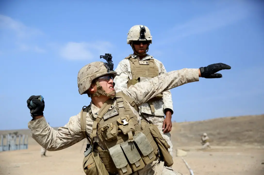 US Marine throws a practice M67 fragmentation grenade during a live-fire exercise