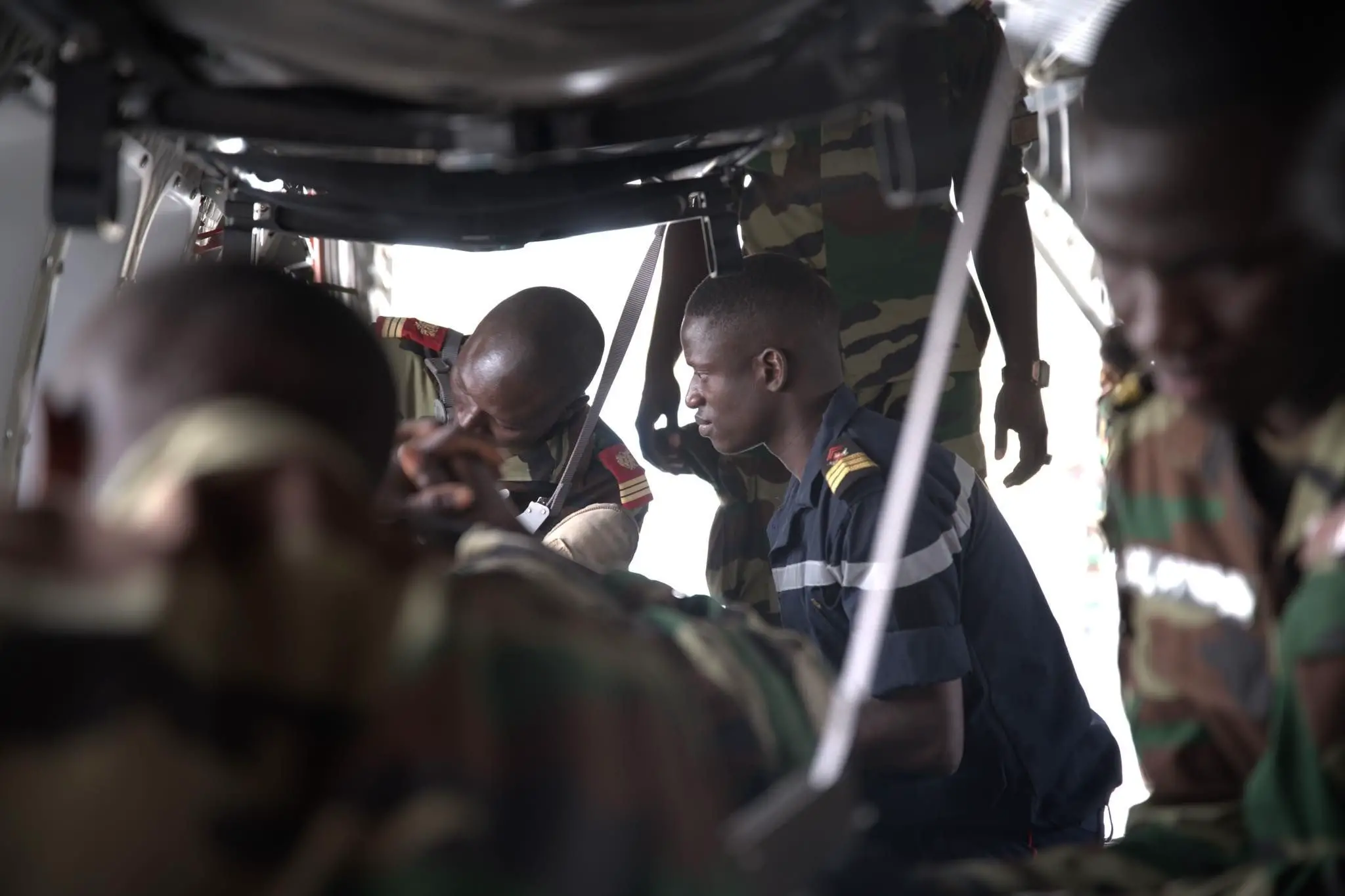 A Senegal Air Force media secures a pa wounded patient on an aircraft during an AMET Phase V training scenario at Ouakam Air Base, Senegal, Jan. 24, 2024. The completion of Phase V underscores their commitment to maintain peace and stability and positions Senegal as a valuable contributor in future UN missions. (U.S. Air Force photo by Dreshawn Murray)