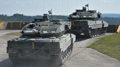 Swedish soldiers with the Wartofta Tank Company, Skaraborg Regiment in their Stridsvagn 122 main battle tank tow away another tank as part of the Chemical, Biological, Radiological, Nuclear, and Explosive Agents lane during the Strong Europe Tank Challenge at the 7th Army Training Command’s Grafenwoehr Training Area, June 4, 2018. The U.S. Army Europe and the German Army co-host the third Strong Europe Tank Challenge, which is an annual training event designed to give participating nations a dynamic, productive and fun environment in which to foster military partnerships, form Soldier-level relationships, and share tactics, techniques and procedures. (U.S. Army photo by Gertrud Zach)