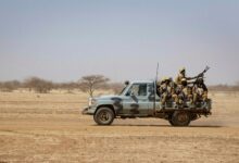 Burkinabe soldiers aboard a military vehicle