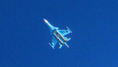 A Russian Air Force Sukhoi Su-34 flies over the city of Binnish in the eastern part of the Idlib province in northwestern Syria