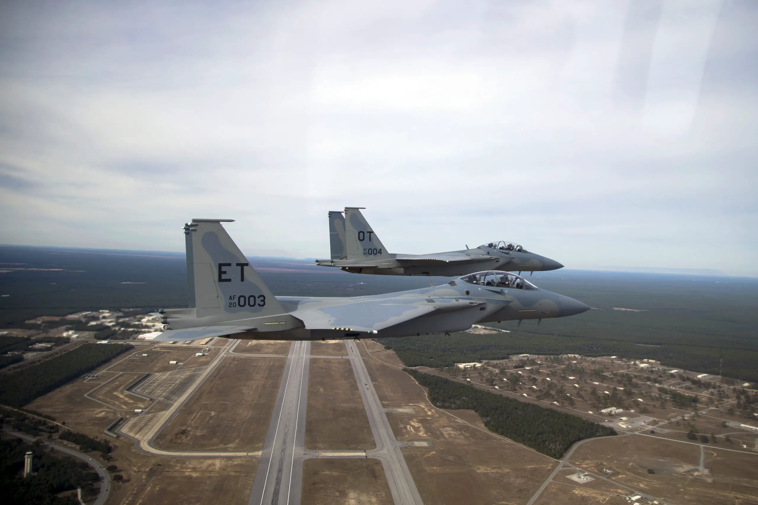 Two new F-15EX fighter jets, EX3 and EX4, arrive at Eglin Air Force Base, Florida, on Dec. 20, 2023. EX3 and EX4 are the Air Force’s newest fighter jets and have updated features such as the cockpit pressure monitor and warning system and an ultra-high frequency antenna for satellite communications. The 40th Flight Test Squadron and 85th Test and Evaluation Squadron will conduct developmental and operational tests on the aircraft. (U.S. Air Force photo by Staff Sgt. Blake Wiles)