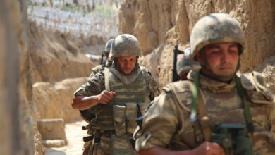 Azerbaijani soldiers patrol to respond to possible new attacks