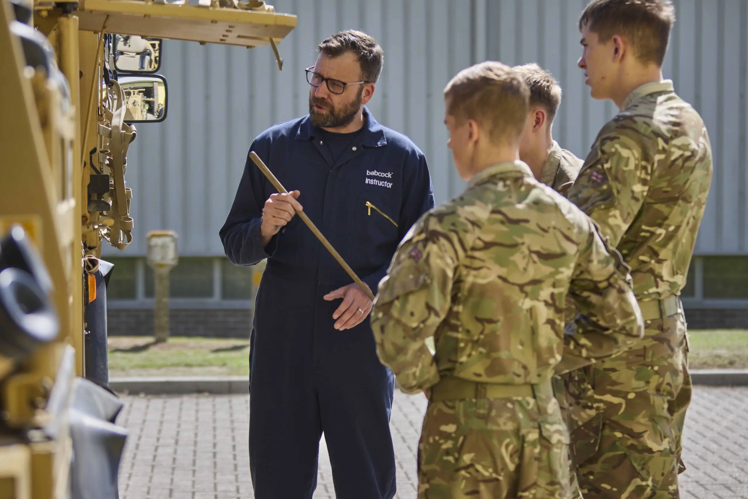 Instructor relays armored vehicle lessons to troops