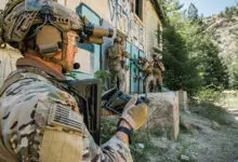 Soldier operating a robotic system controller