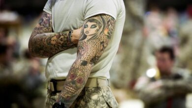 soldier with full-sleeve tattoos
