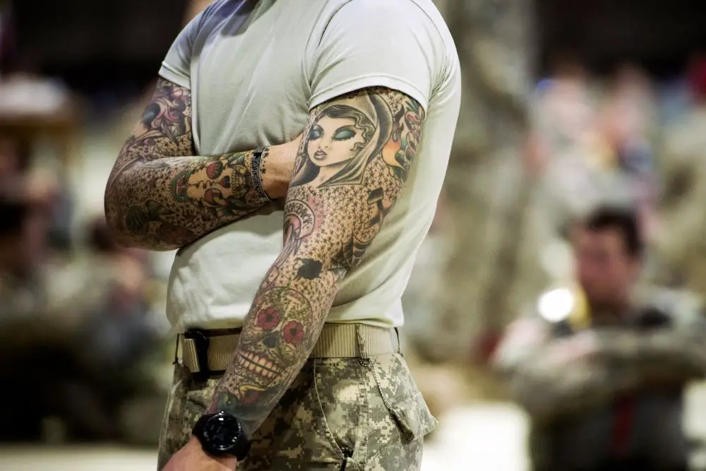 soldier with full-sleeve tattoos