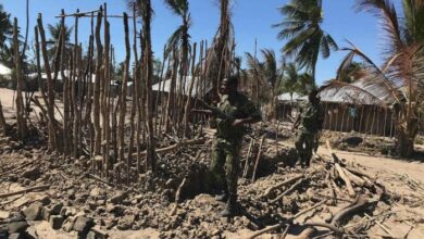 Mozambican soldiers inspect a building torched by insurgents in northern Mozambique.