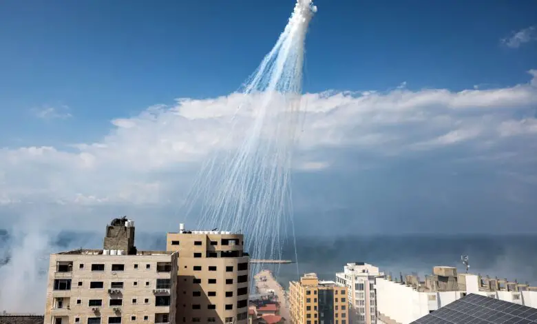 Airbursts of artillery-fired white phosphorus fall over the Gaza city port, October 11, 2023