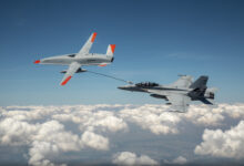 The Boeing MQ-25 T1 test asset transfers fuel to a US Navy F/A-18 Super Hornet on June 4, marking the first time in history that an unmanned aircraft has refueled another aircraft.