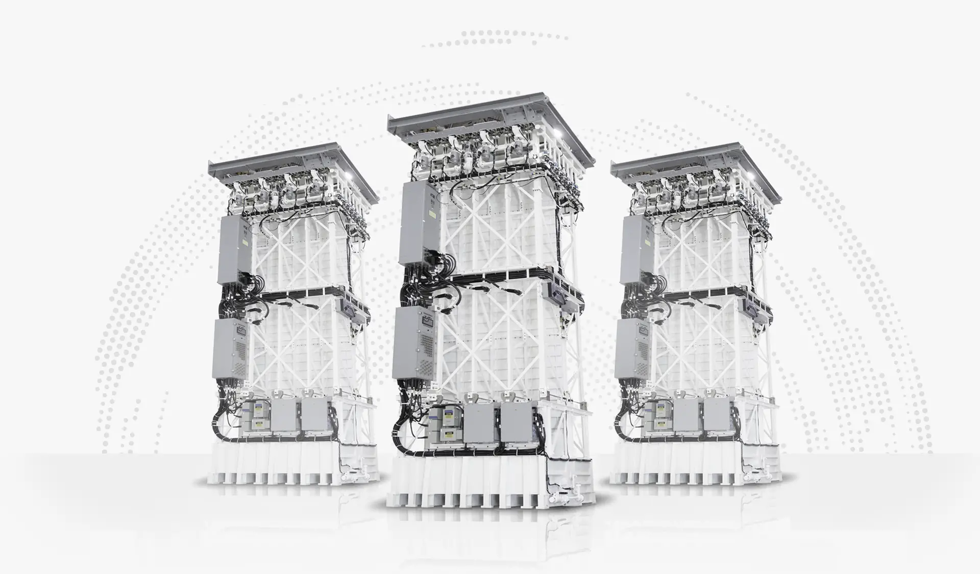 Three MK 41 Vertical Launch Systems are on display. The capability is a tall, tower-shaped equipment with supportive beams and wires fitted onto it. Most of its body is painted white.
