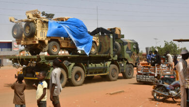 A military truck of the Nigerien security forces, part of an escort to a French Army military convoy crosses the Lazaret district in Niamey