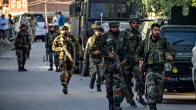 Security personnel arrive near the scene of a militant attack at Pandach Chowk