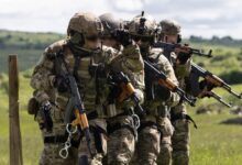 Romanian Special Forces operators prepare to execute a simulated breach during exercise Steadfast Defender 2021.