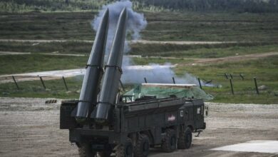 Russian officials give a presentation of the Iskander M missile