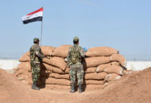 Syrian regime forces manning a position in the countryside city of Kobane, also known as Ain al-Arab, along the border with Turkey