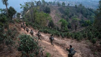 Members of the Ta'ang National Liberation Army patrol in Shan state, Myanmar