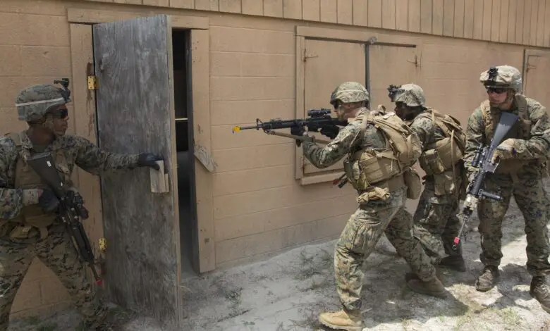 US Marines practice entering buildings during a military operations on urban terrain exercise at Marine Corps Base Camp Lejeune, 2015