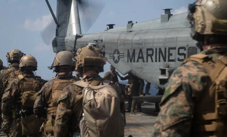 US Marines exfiltrate towards a CH-53E Super Stallion during a simulated visit, board, search, and seizure mission aboard dock landing ship USS Germantown in the South China Sea, 2020