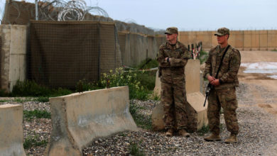 US soldiers stand at the Qayyarah Air Base, where US-led troops in 2017 helped Iraqis plan out the fight against the Islamic State in nearby Mosul